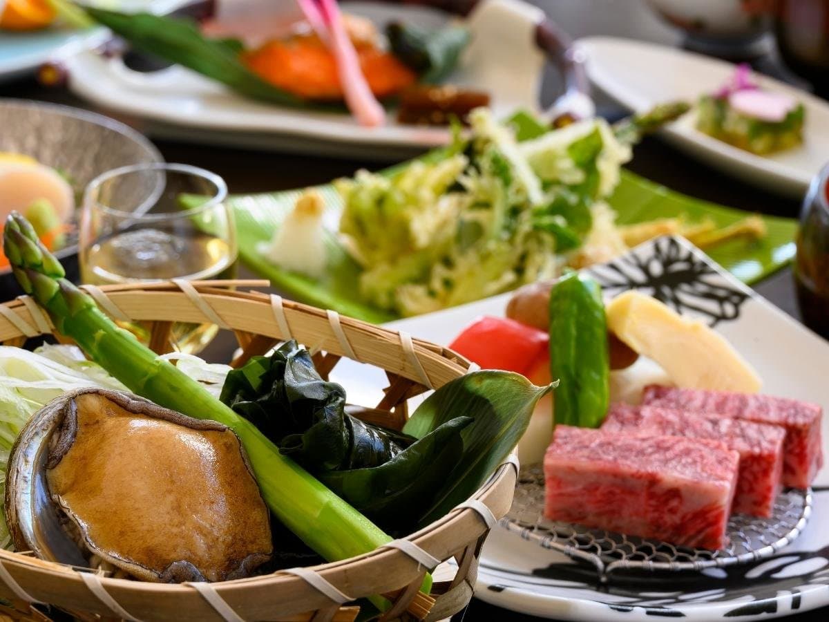 Kaiseki dinner spread with marbled wagyu beef, grilled abalone and seasonal vegetables at Hotel Waldberg