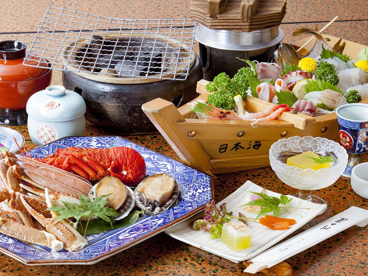 Seafood dinner set with grilled snow crab, abalone and assorted sashimi platter, Kawaguchiya Honkan, Kinosaki Onsen