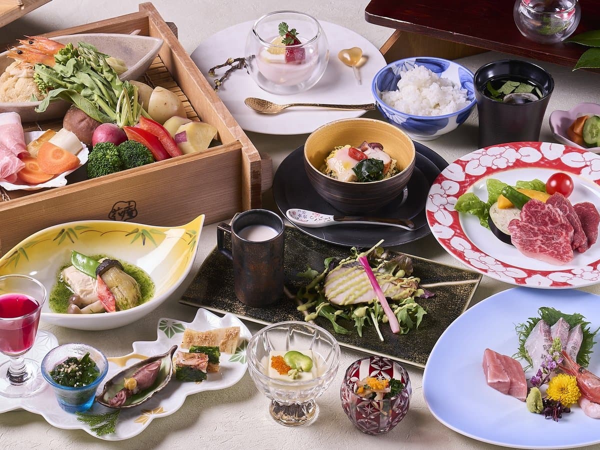 Multi-course kaiseki dinner spread with wagyu, sashimi, and seasonal vegetables at Hotel Hana-An