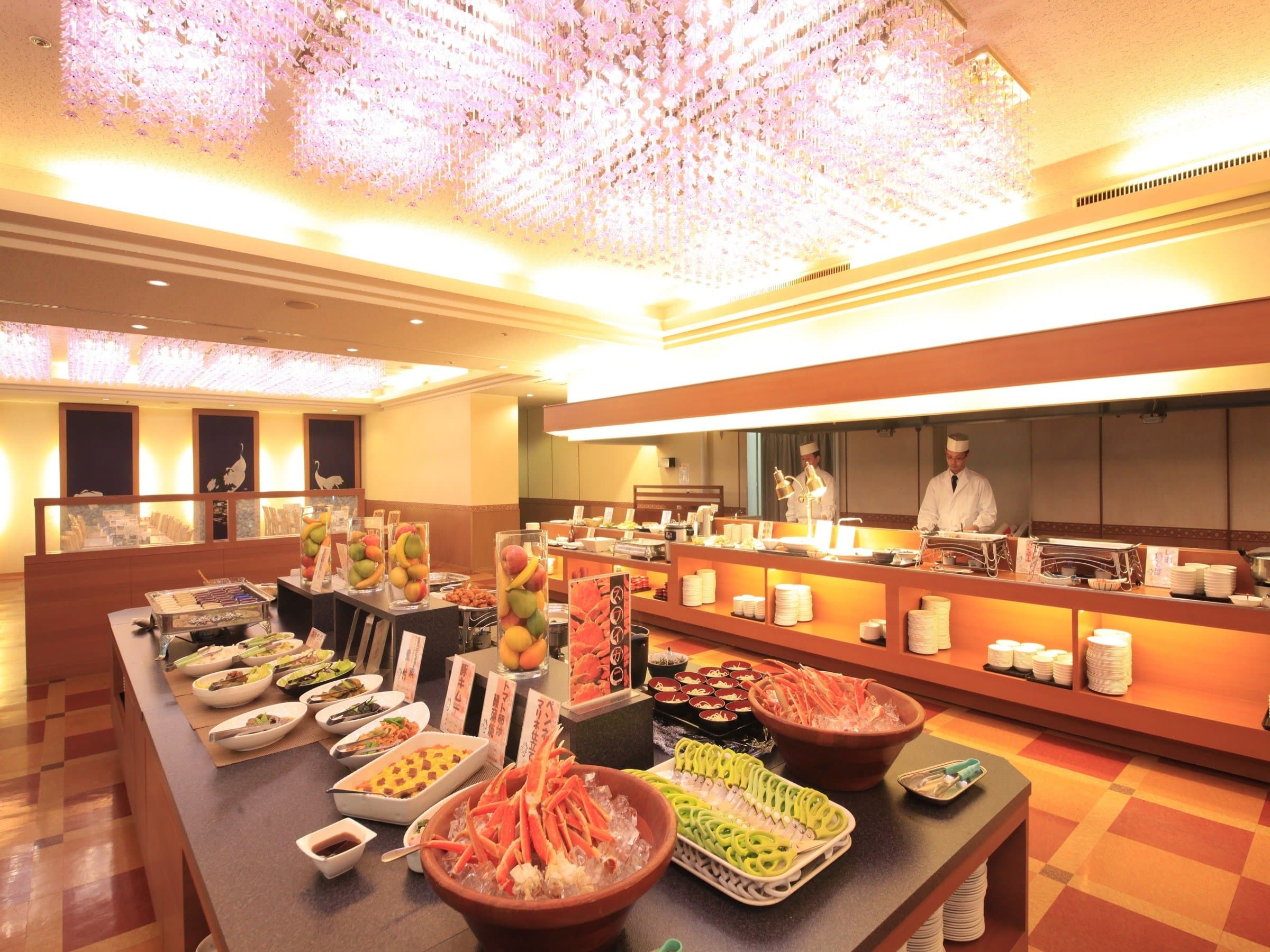Dinner buffet spread of seafood, crab and fresh dishes under chandelier lighting at Park Hotel Miyabitei in Noboribetsu Onsen