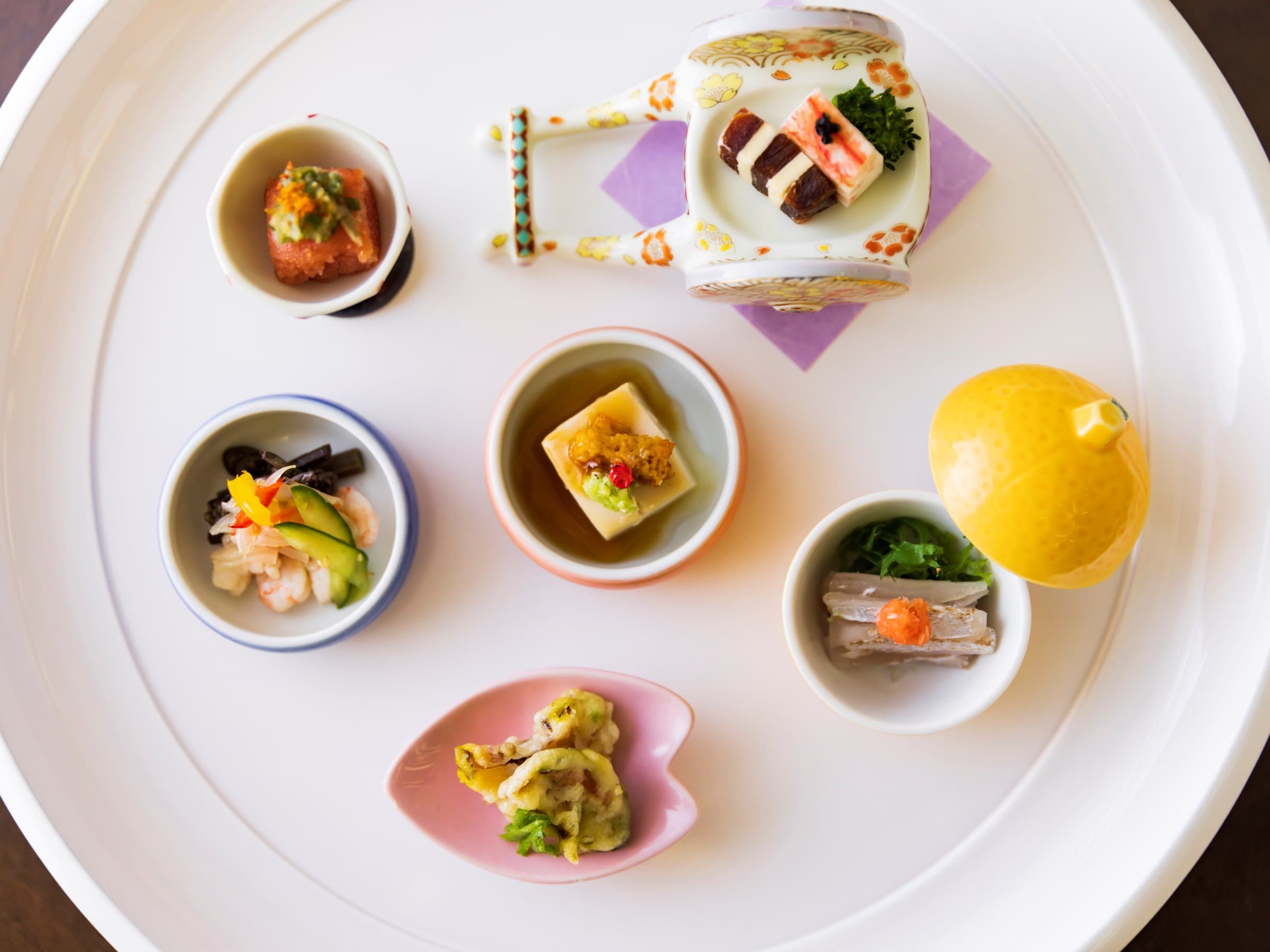 Elegant kaiseki appetizer assortment of small seasonal dishes at Inatori Ginsuiso
