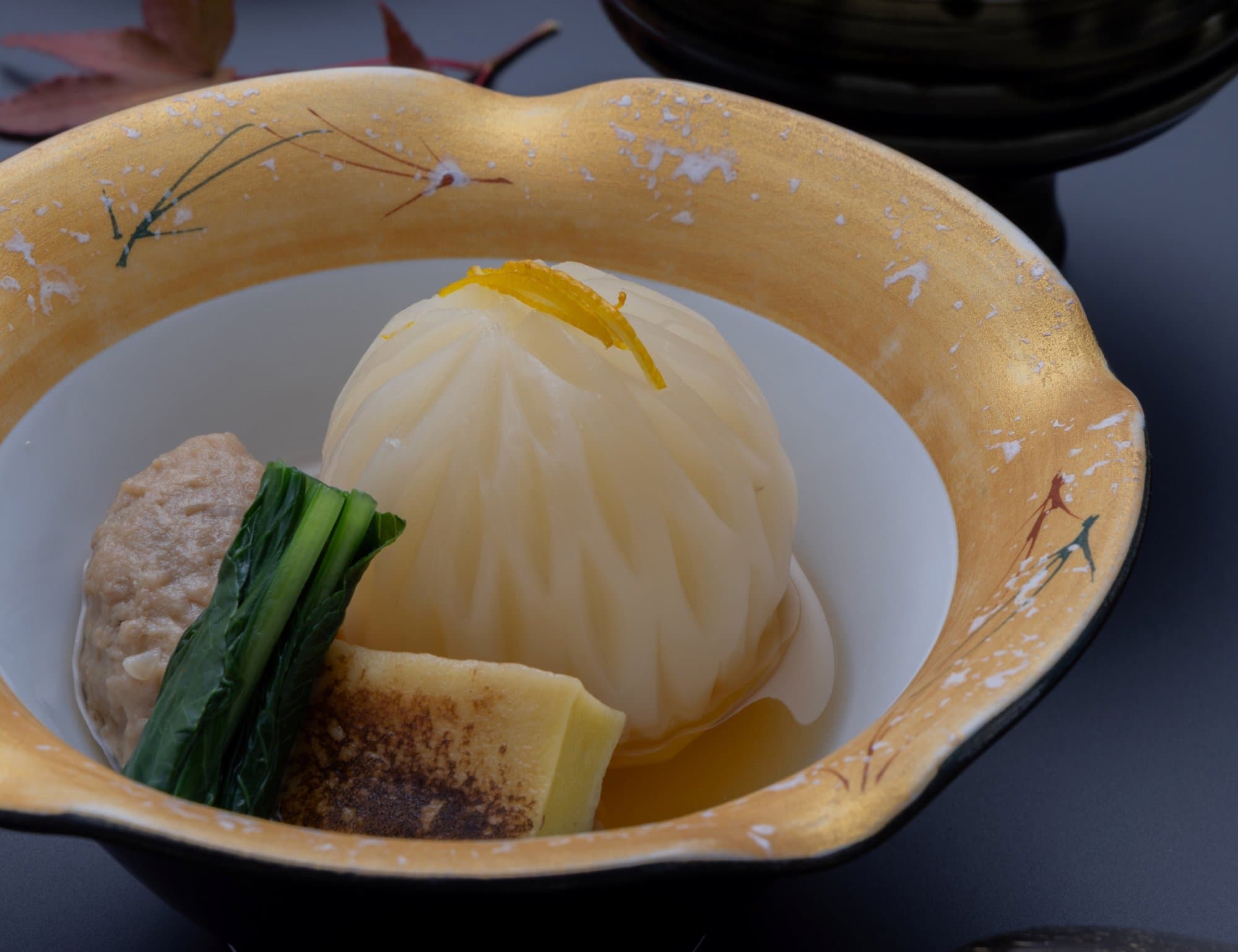 Kaiseki simmered course in a lidded bowl with seasonal garnish at Kanemidori
