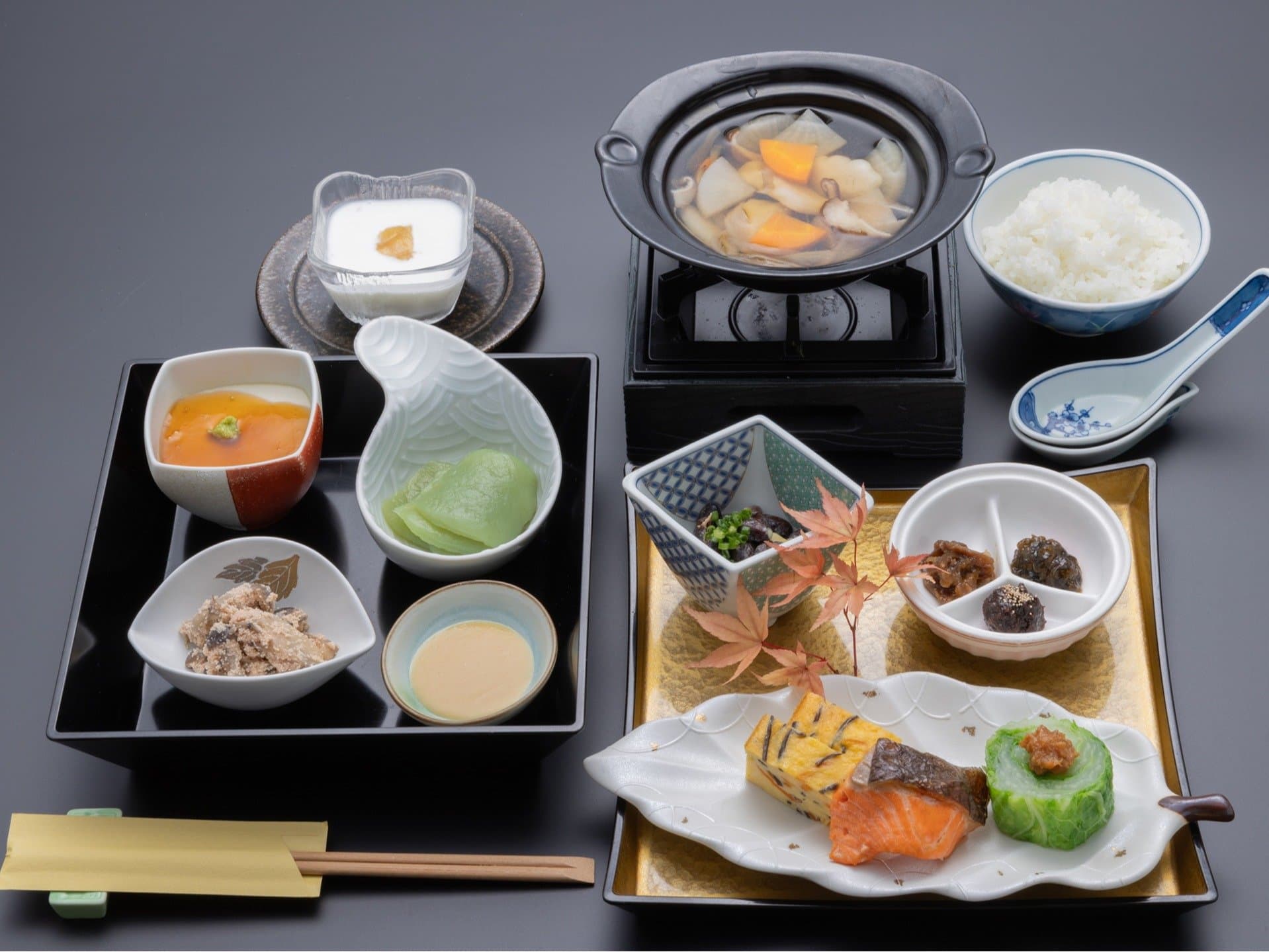 Japanese breakfast set with rice, simmering nabe, grilled salmon, tamagoyaki and small side dishes at Kanemidori