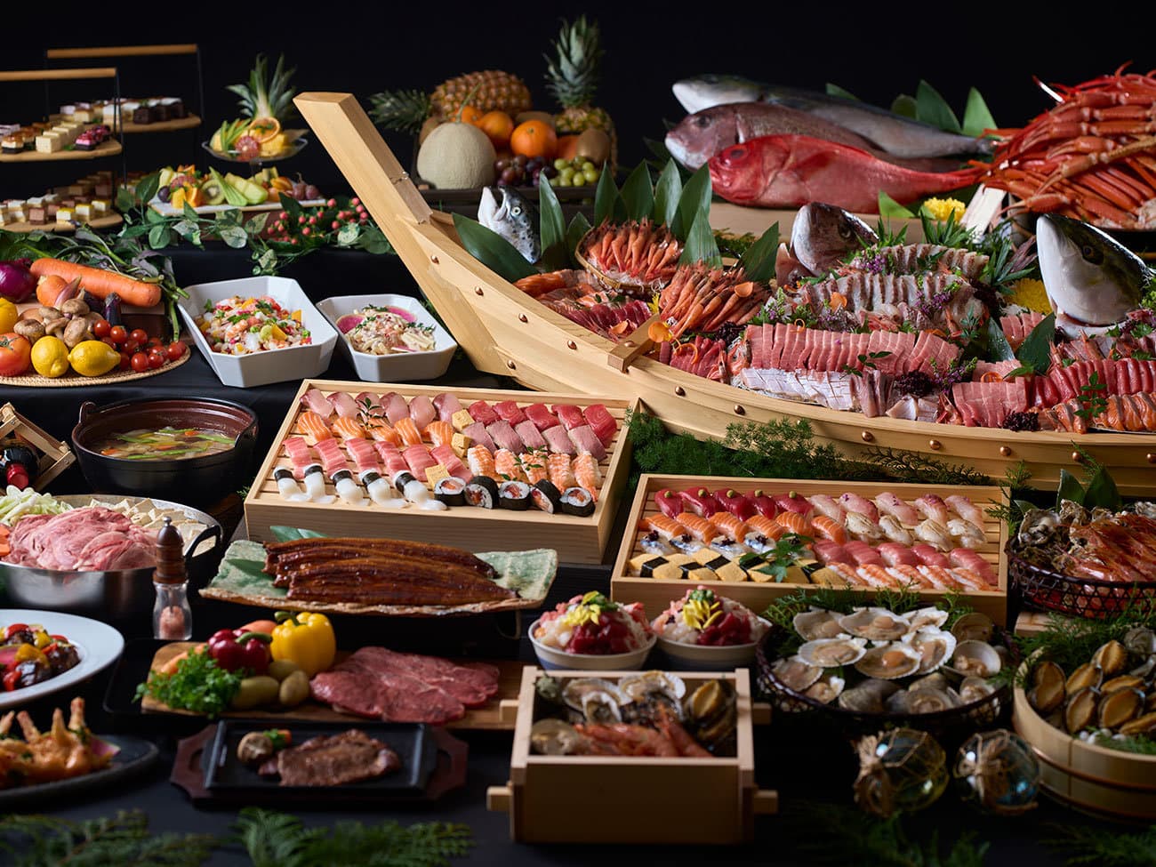 Lavish buffet dinner spread of sushi, sashimi, crab, grilled meats and seasonal dishes
