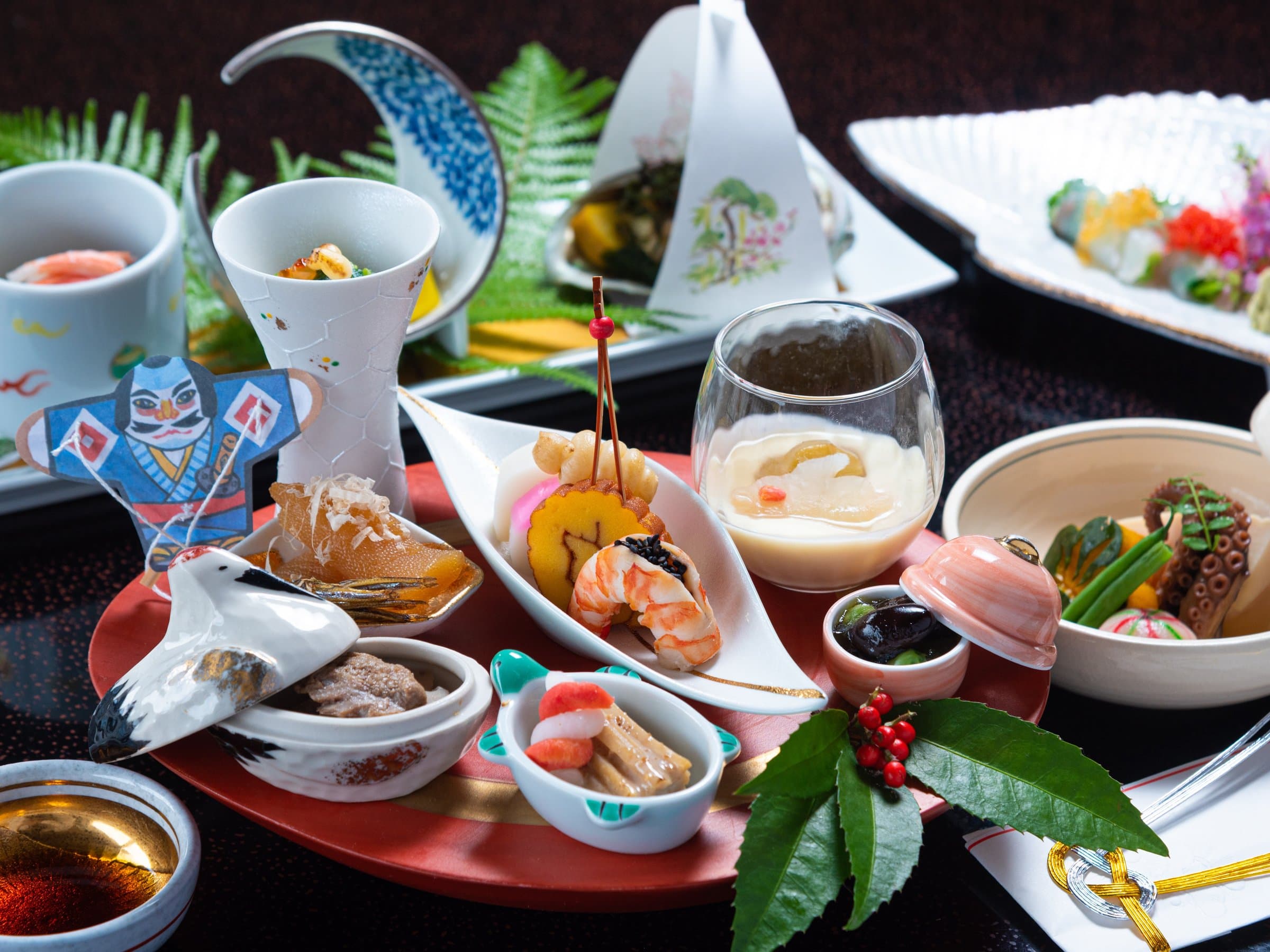 Multi-course kaiseki dinner of seasonal Japanese dishes plated on artisan ceramics at Sagasawakan