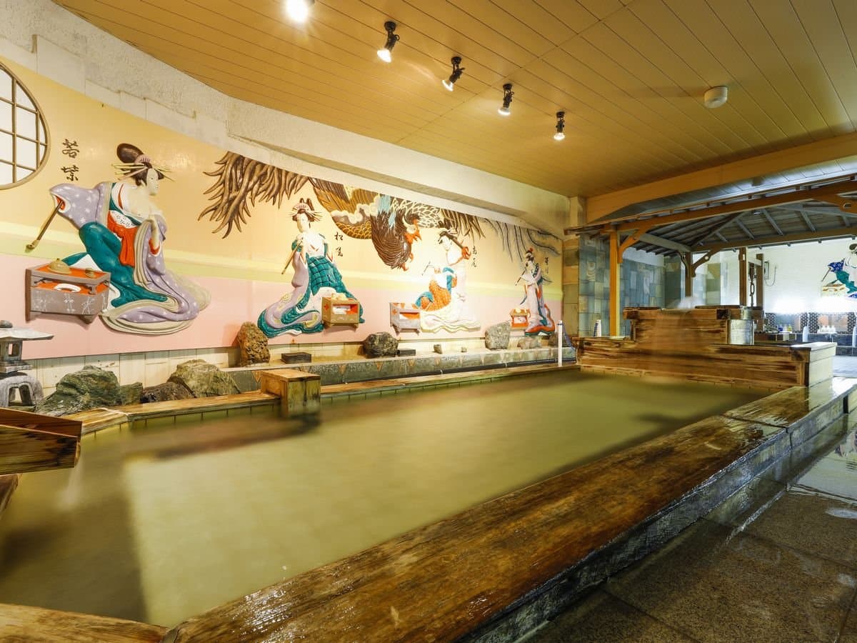 Indoor hot spring bath with a hand-painted ukiyo-e mural at Hotel Katsuragi, Dogo Onsen