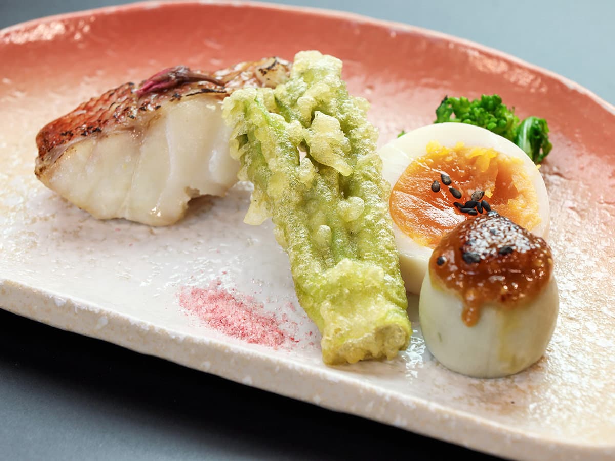 Grilled white fish with tempura vegetable and seasonal garnishes from Showakan's kaiseki menu