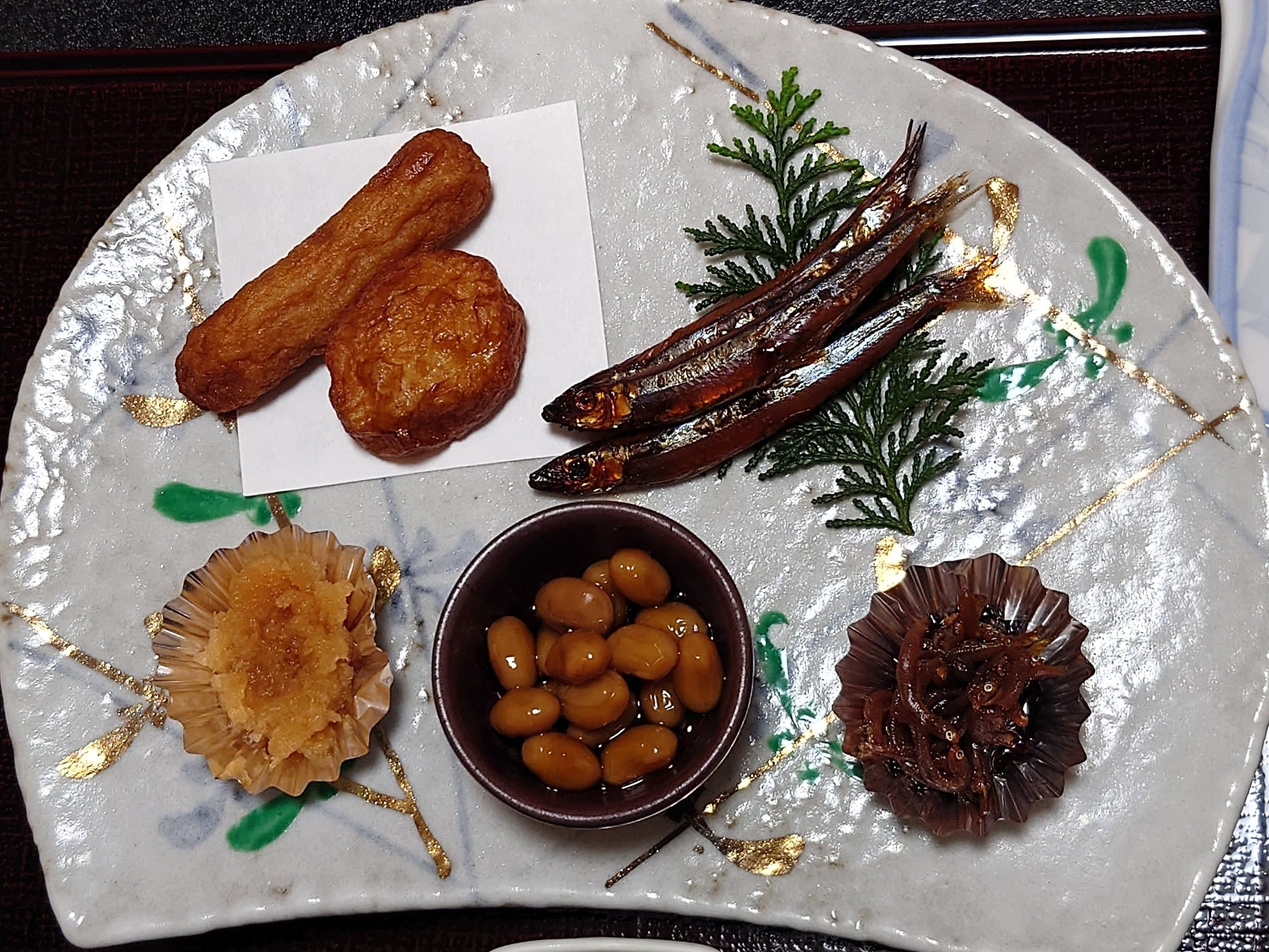 Japanese breakfast plate with satsuma-age and grilled kibinago at Ryokan Tsukimiso, Ibusuki