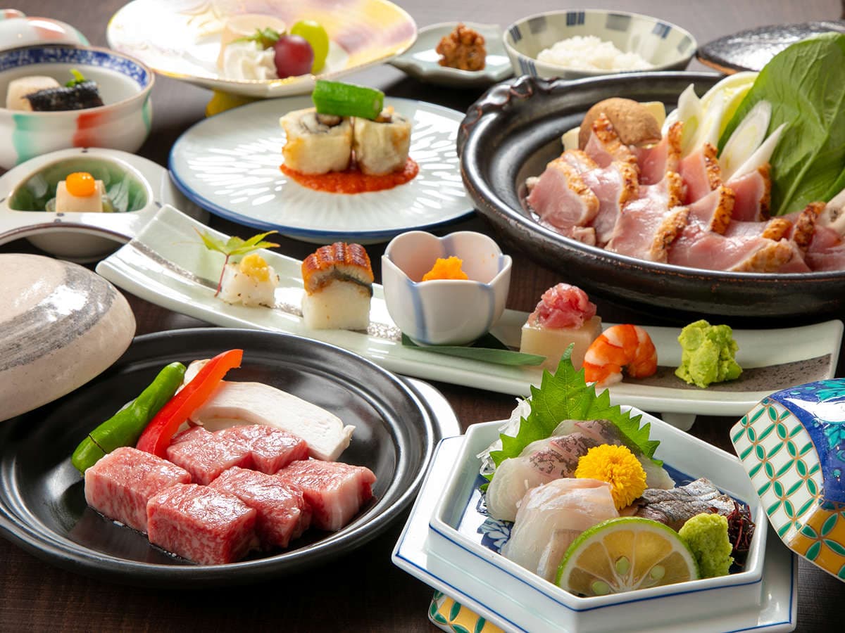 Kaiseki dinner spread with wagyu beef, sashimi and small seasonal dishes served at Oyado Ichizen