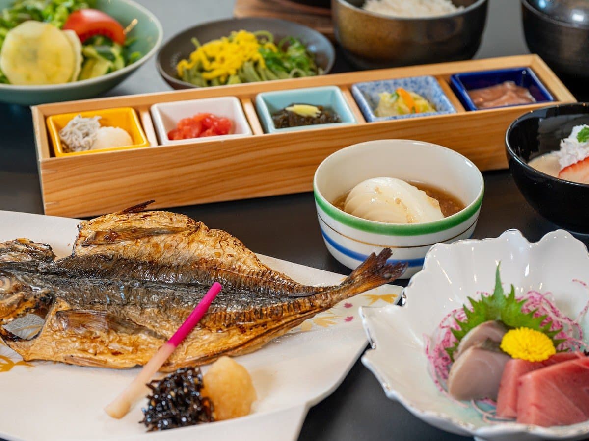 Japanese breakfast set with grilled fish, sashimi and assorted small dishes at ISHINOYA Atami