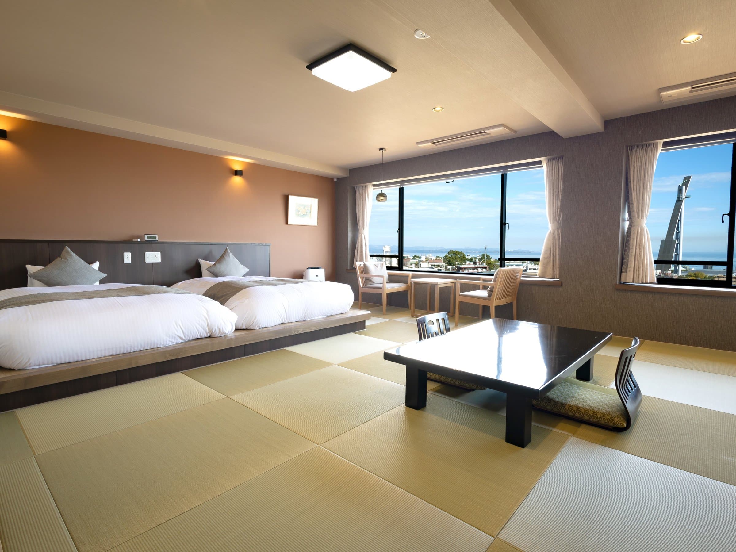 Eleven-tatami Japanese-Western sea-side guest room with bay views and comfortable lounge seating, Ryokan Chobonoyado Shiori, Beppu Onsen