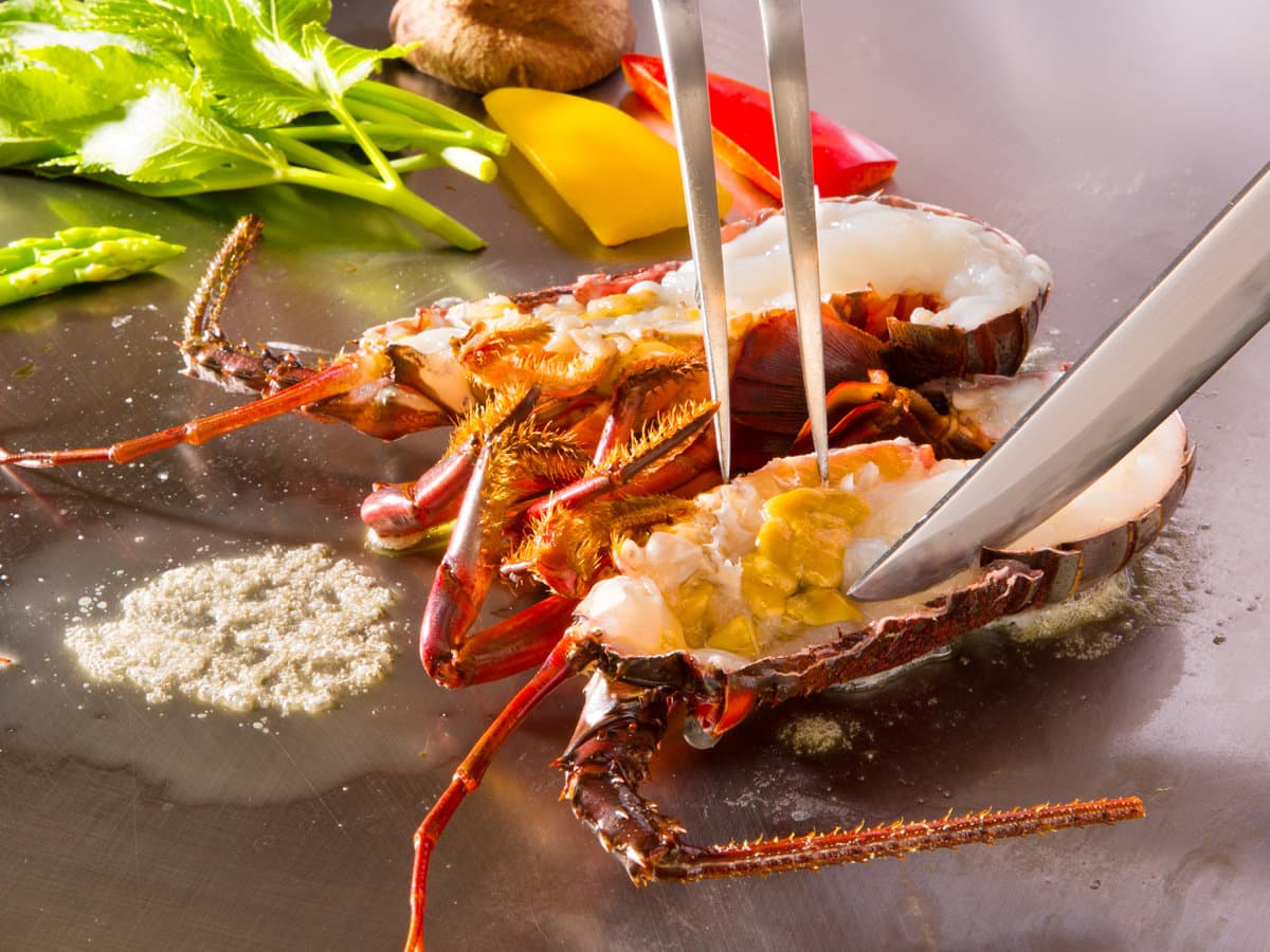 Grilled spiny lobster prepared on a teppan griddle as part of dinner at Kissho Caren