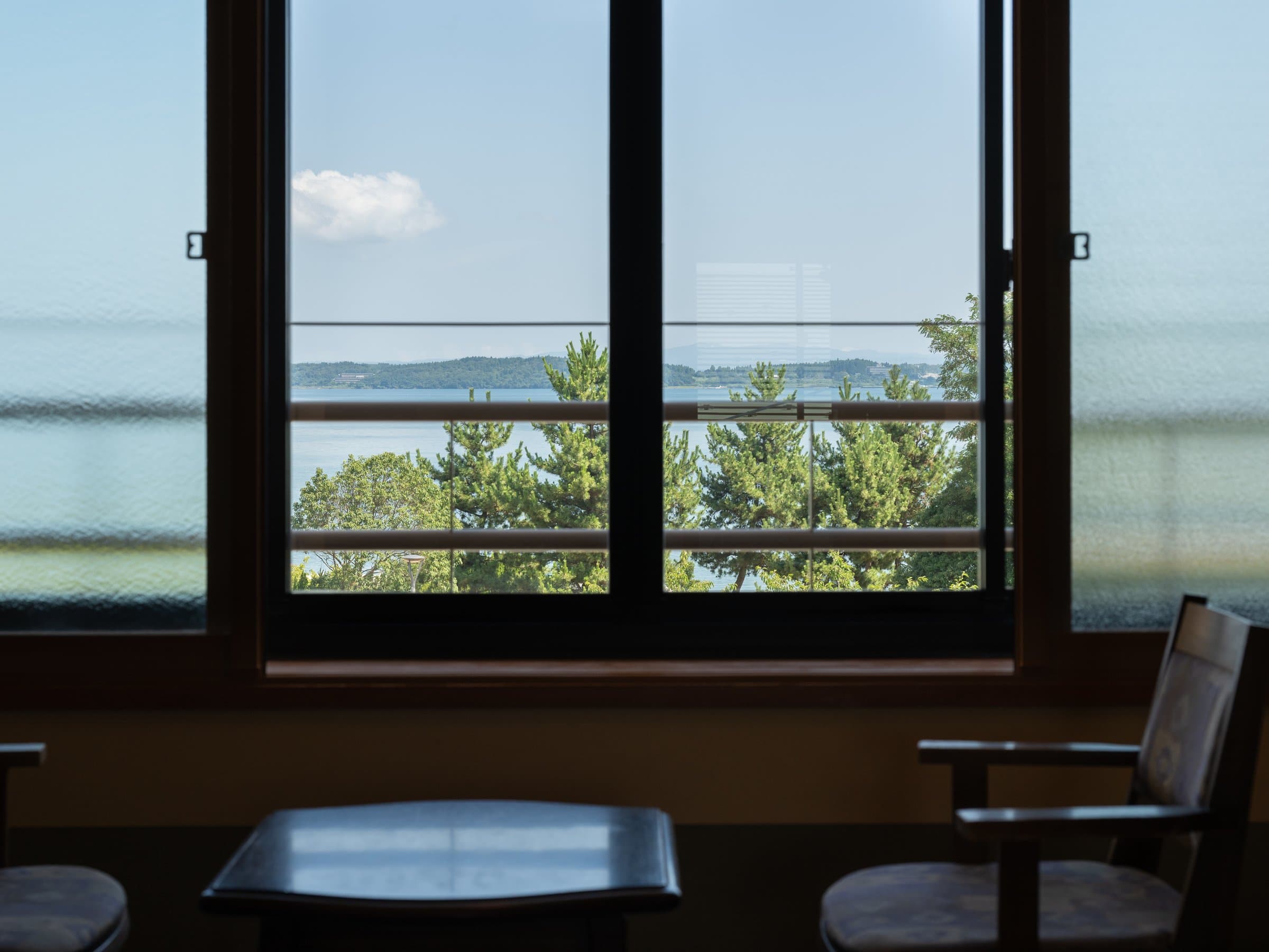 Japanese guest room window at Hamazuru overlooking the sea and Notojima island at Wakura Onsen
