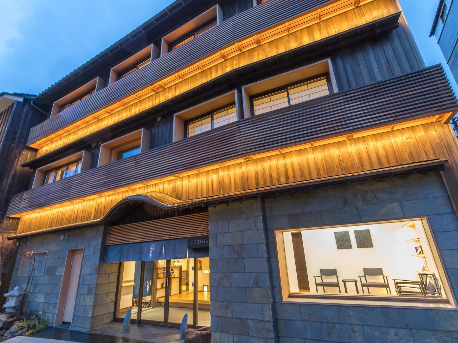 Ichidaya ryokan exterior facade in Kinosaki Onsen at twilight