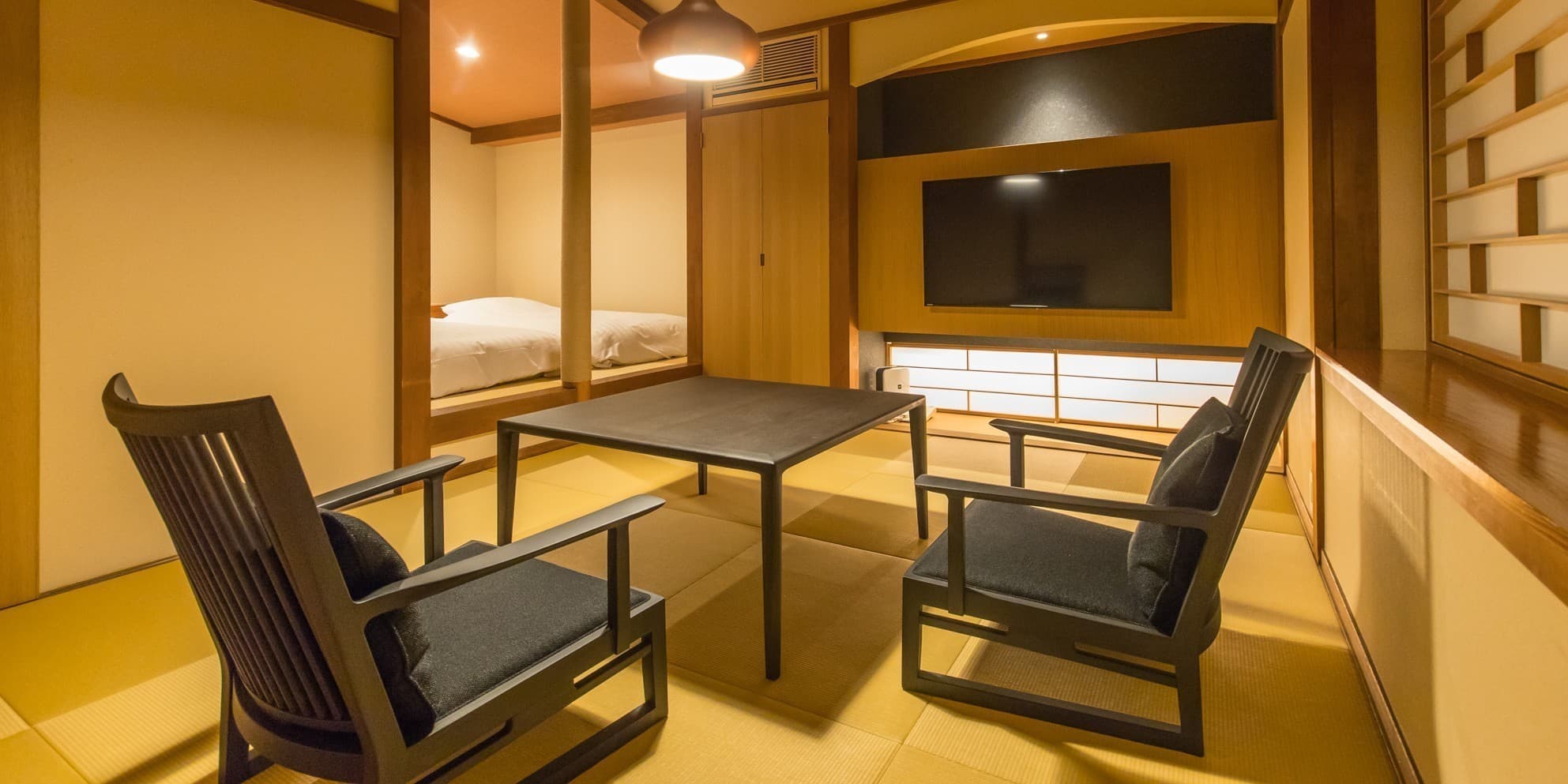 Guest room Mokuren at Ichidaya with low table and window seating