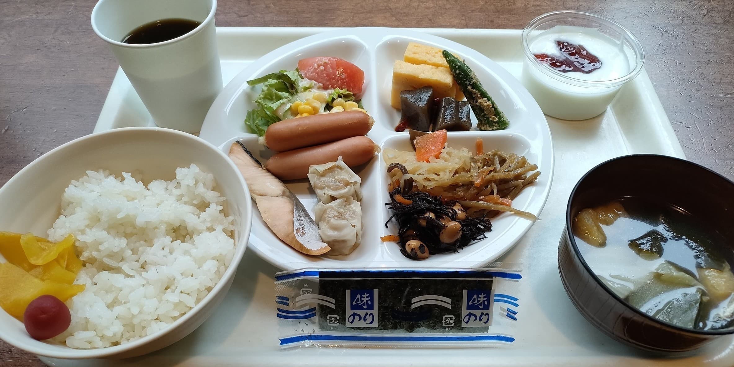 Japanese breakfast tray with rice, grilled fish, miso soup, salad and side dishes at Hotel Edoya, Tokyo