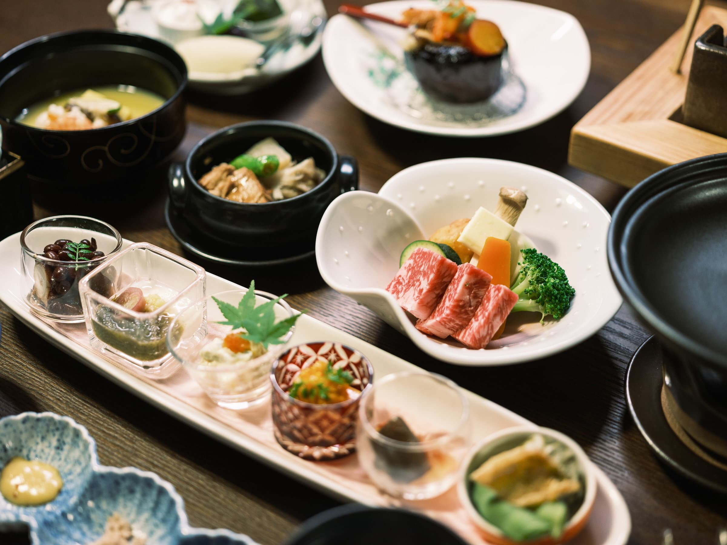 Yumerindo kaiseki dinner spread with Aka-ushi beef, simmered dishes and assorted small plates