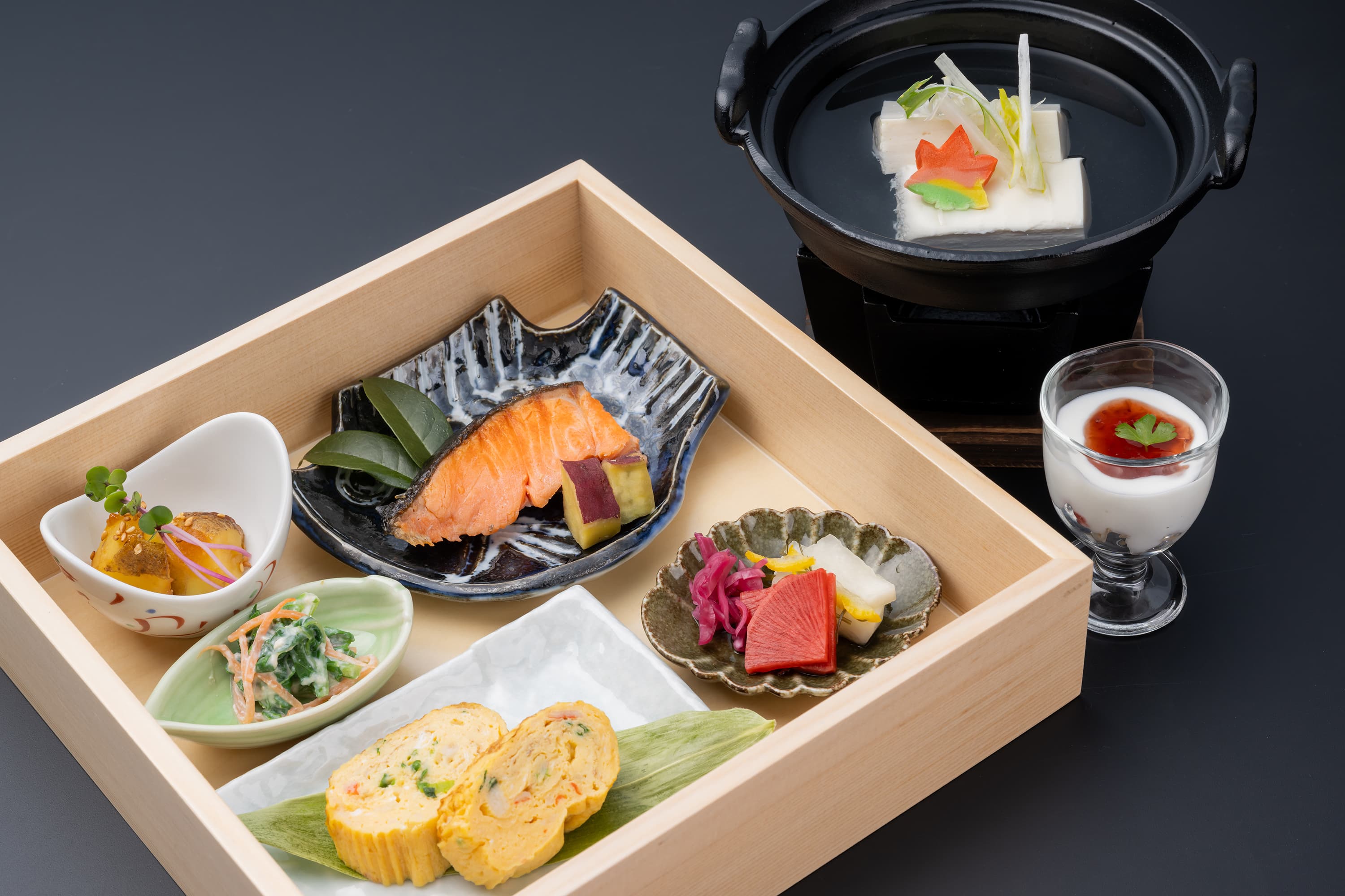 Japanese breakfast set at Kusatsu Onsen Hoshikawa with grilled salmon, rolled omelette, simmered tofu hotpot and yogurt