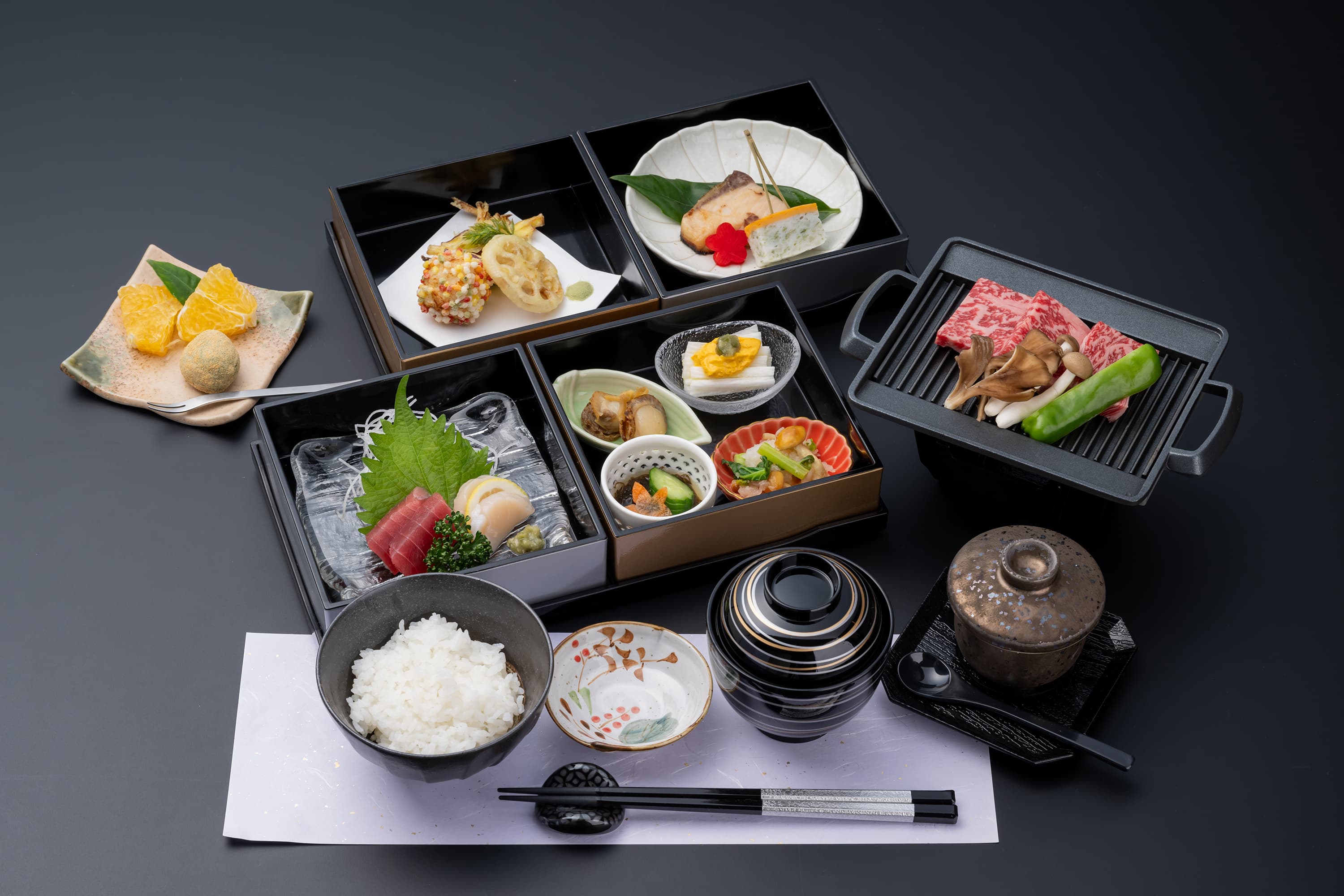 Multi-course kaiseki dinner at Kusatsu Onsen Hoshikawa with sashimi, tempura, grilled wagyu beef and assorted small dishes
