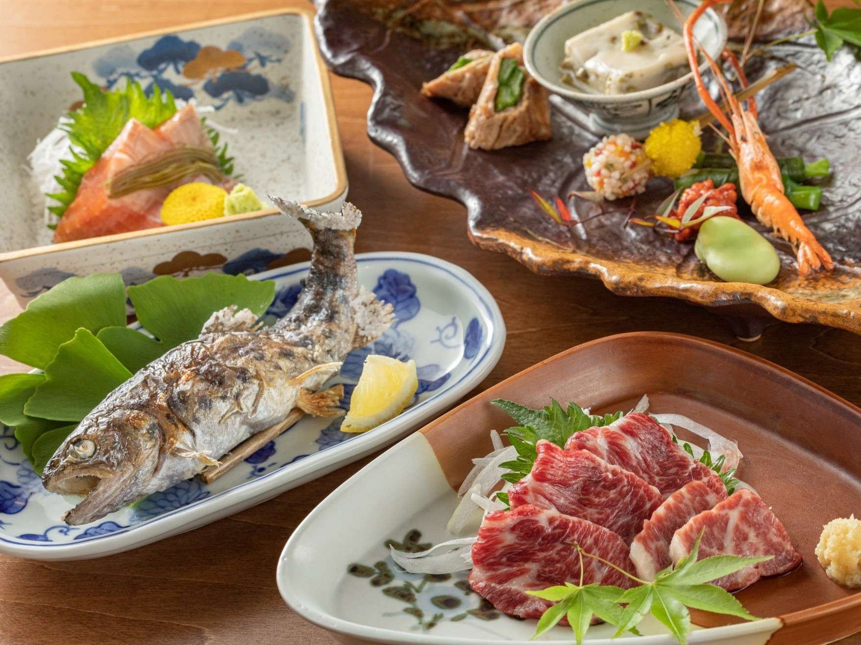 Plated kaiseki course featuring local Kumamoto produce at Ryokan Nanjoen