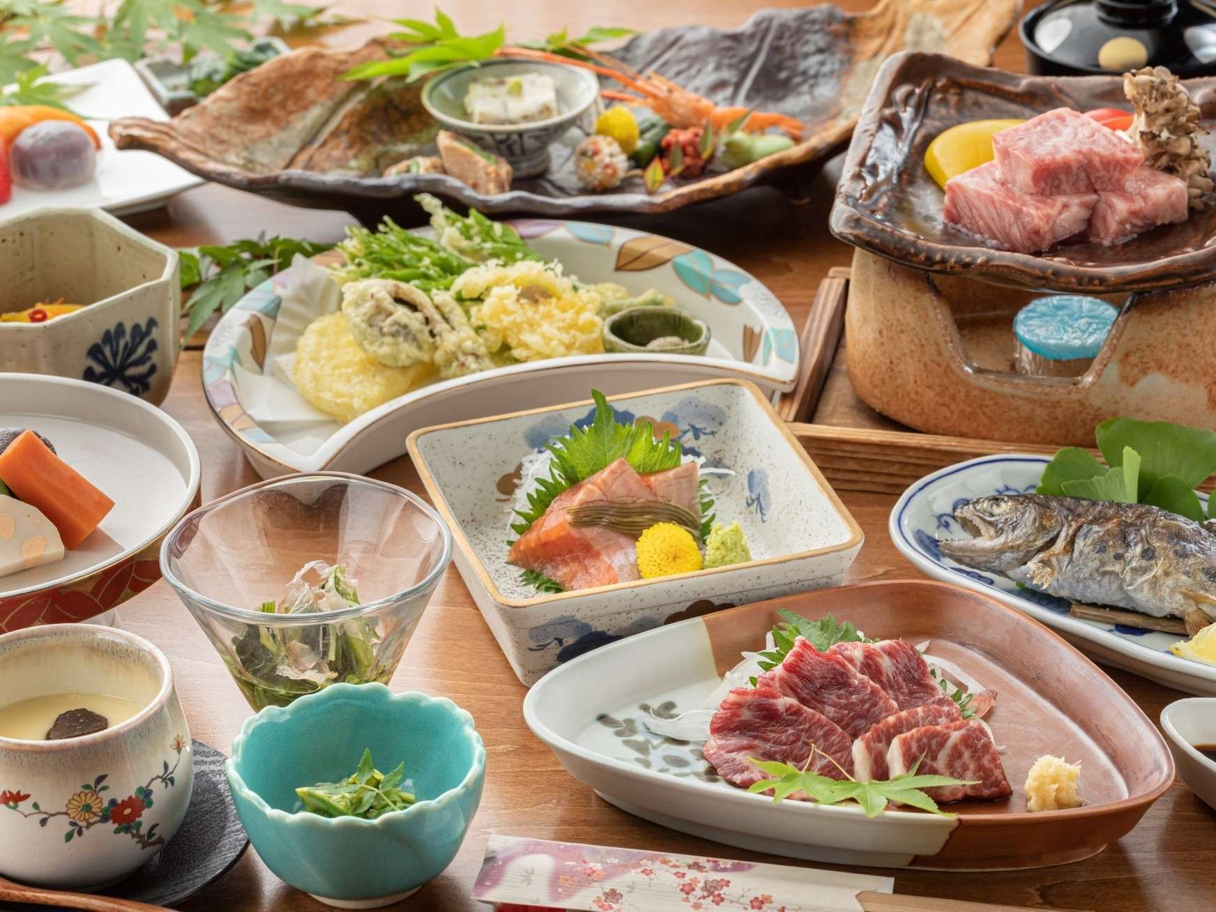 Multi-course kaiseki dinner with seasonal ingredients at Ryokan Nanjoen