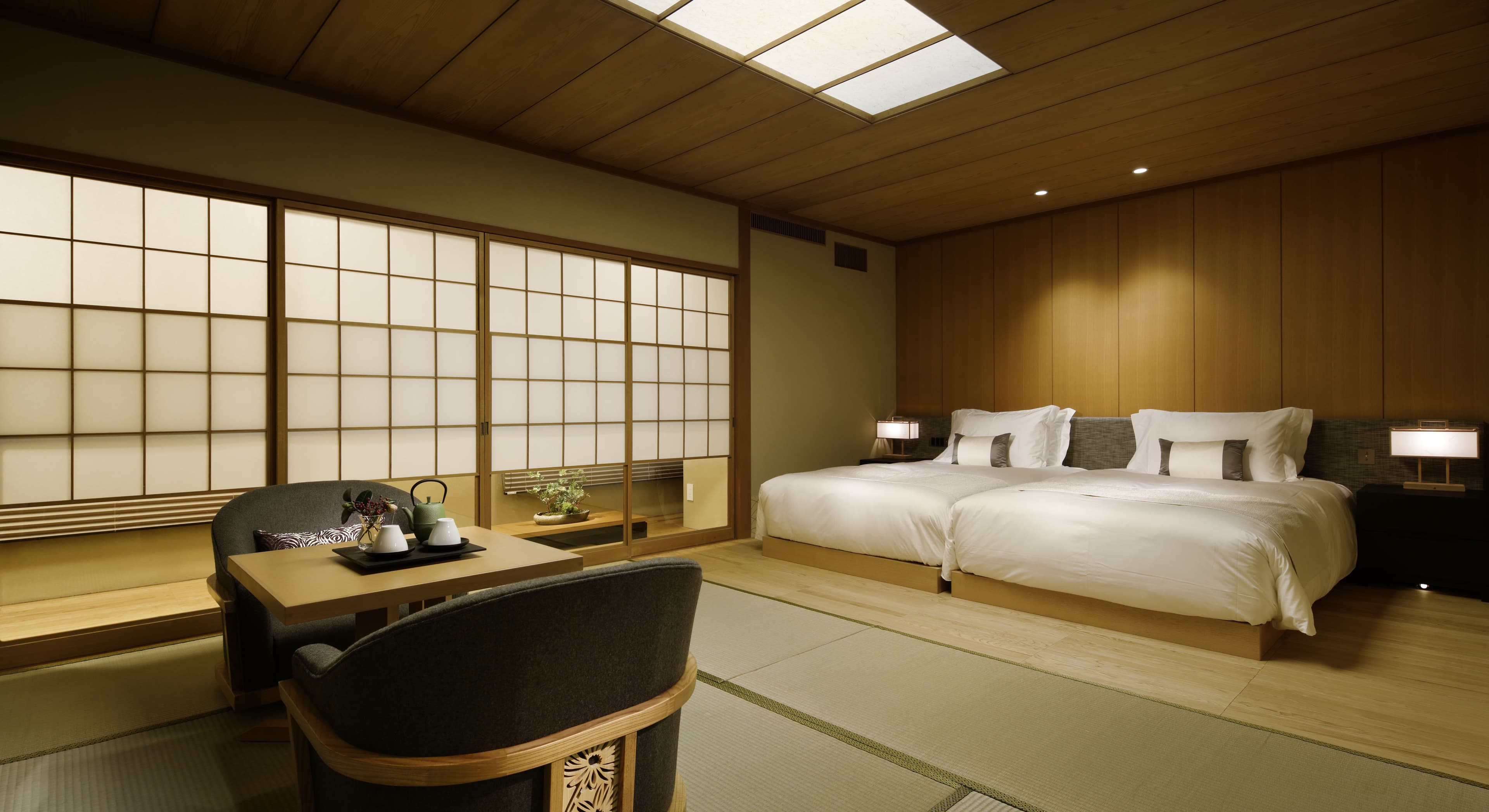 Spacious Japanese Suite with twin beds, wood-panel walls, shoji screens and tatami at Takanawa Hanakohro Tokyo