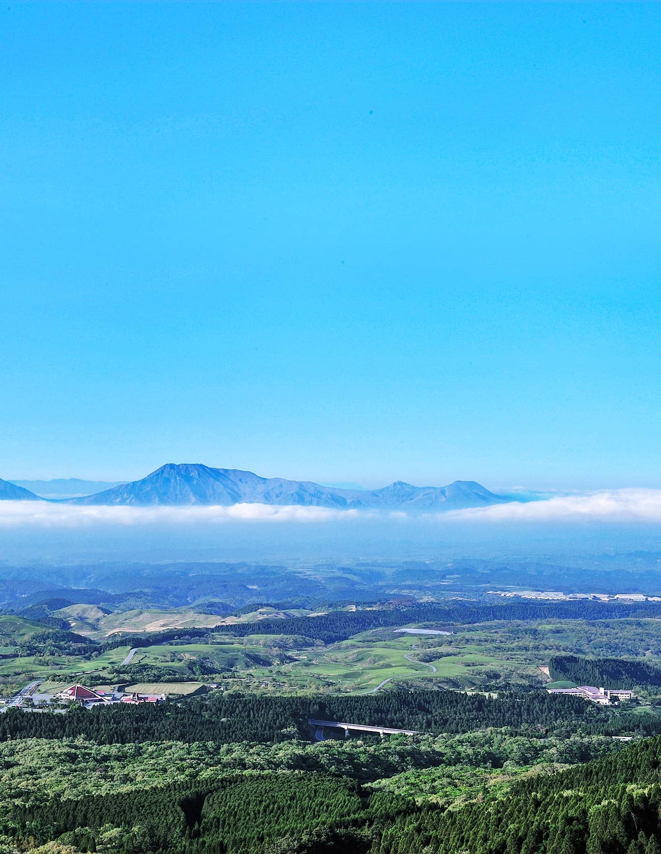 Senomoto Highland's Hotel grounds set against the Aso mountain plateau