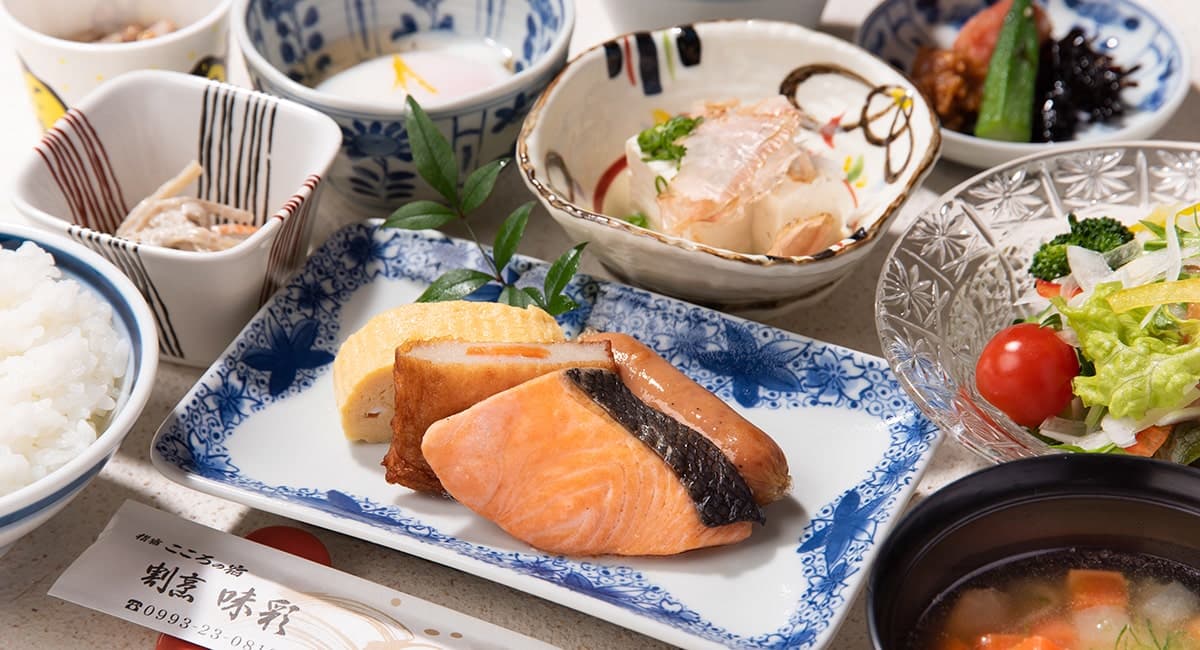 Japanese breakfast set with grilled salmon, rolled omelette, rice, miso soup and side dishes at Ibusuki Kokoro no Yado