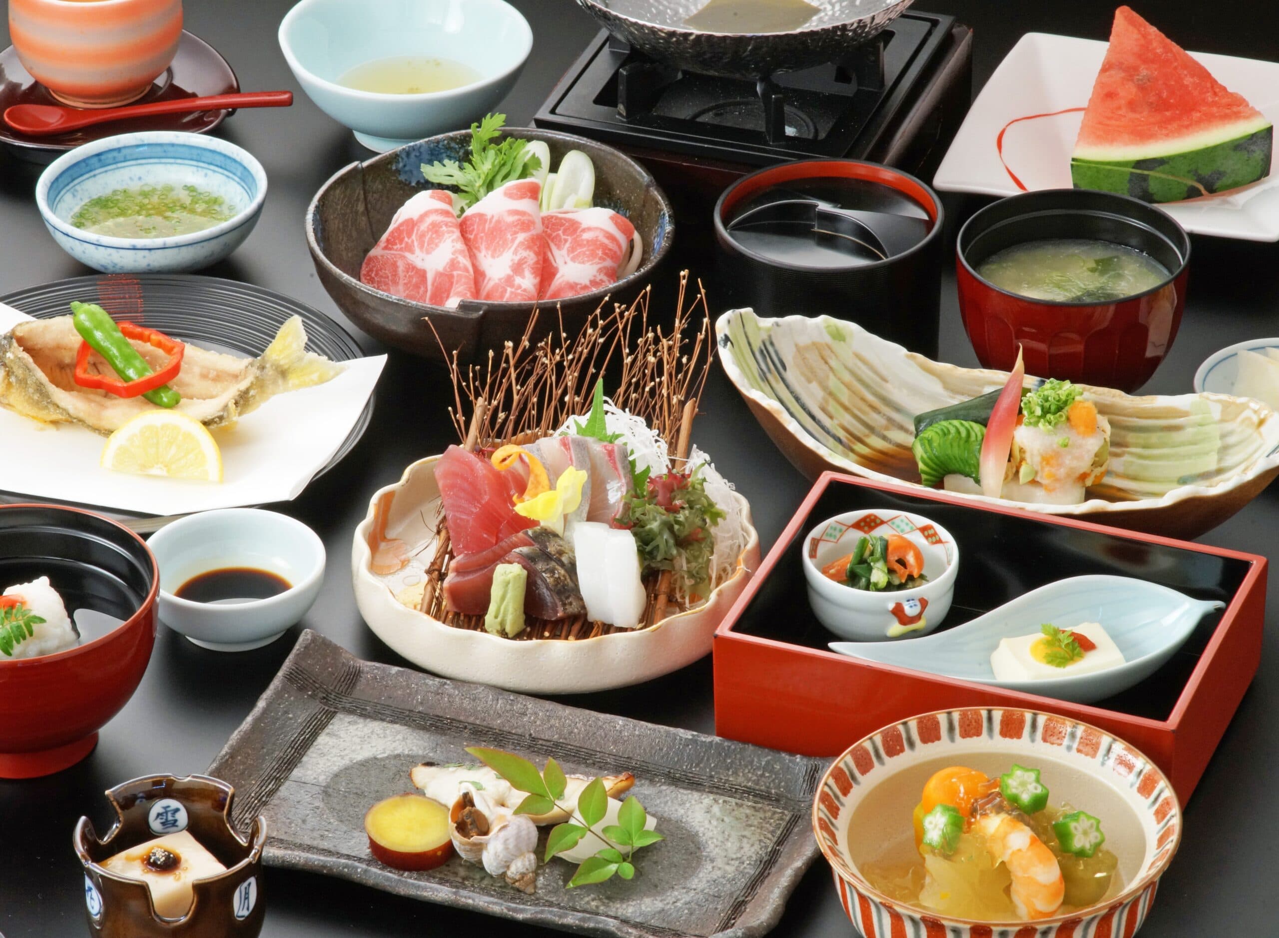 Multi-course kaiseki dinner with sashimi, beef shabu-shabu and assorted Kagoshima local dishes at Ibusuki Kokoro no Yado
