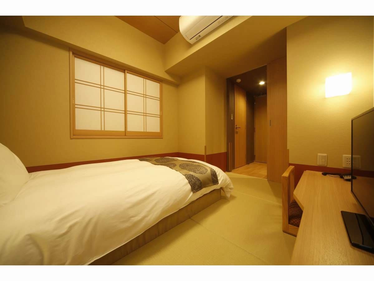 Single guest room at Onyado Nono Nara with tatami-style flooring, low bed and shoji window