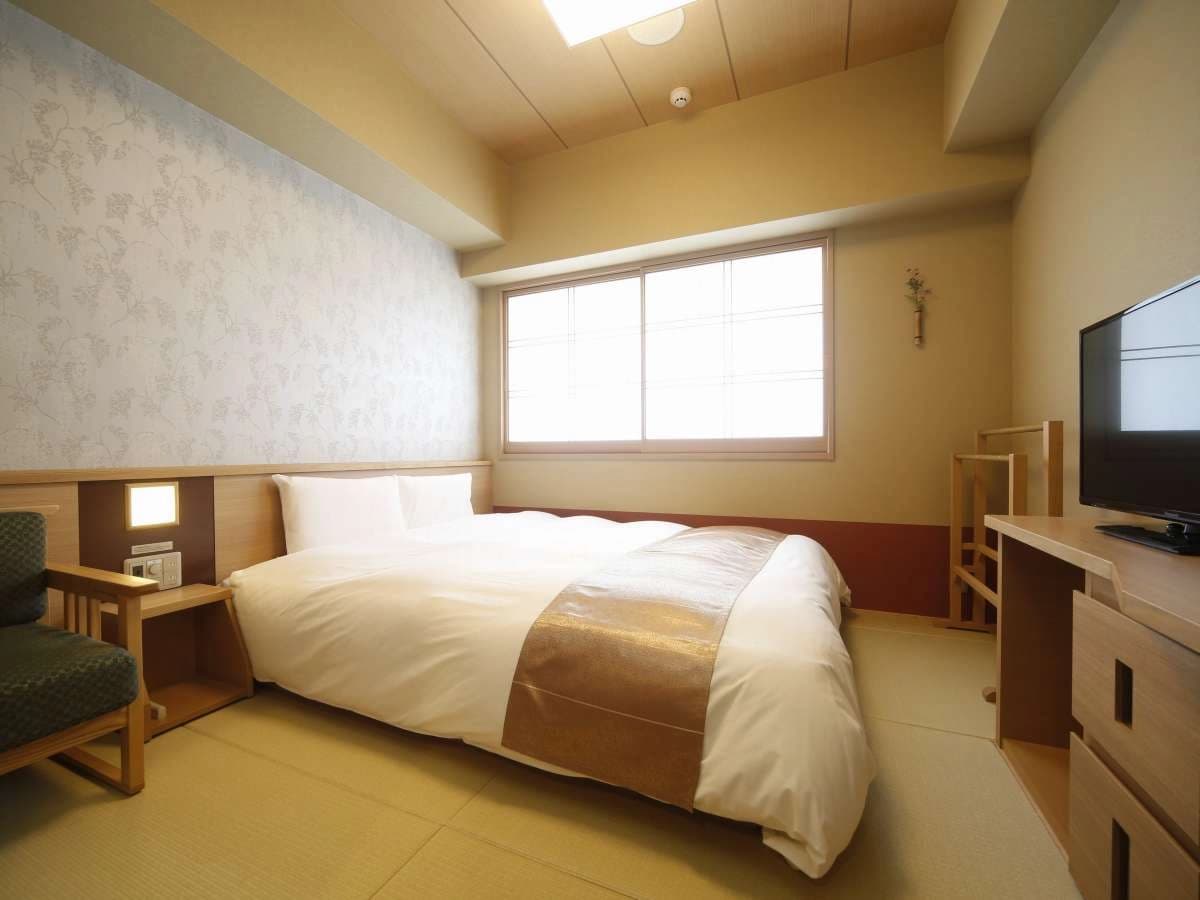 Double guest room at Onyado Nono Nara with floral accent wall and tatami-style flooring