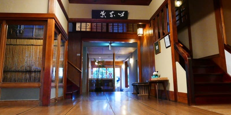 K's House Ito Onsen entrance hall with traditional zelkova wood floors