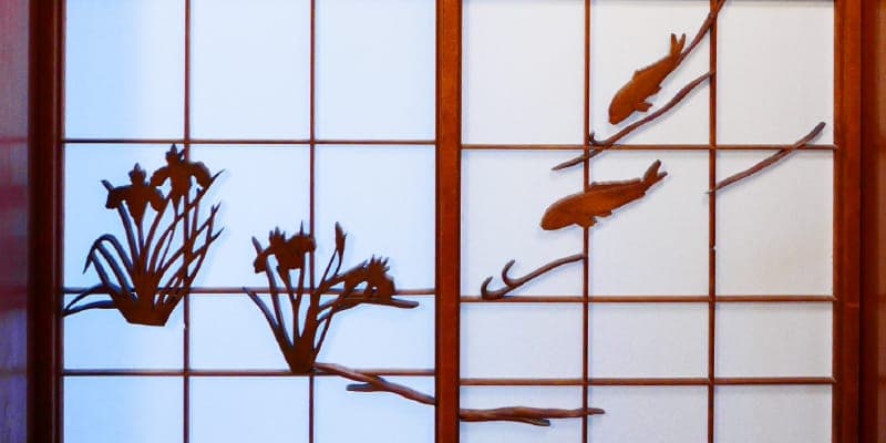 Traditional Japanese sliding doors and woodwork inside K's House Ito Onsen heritage building