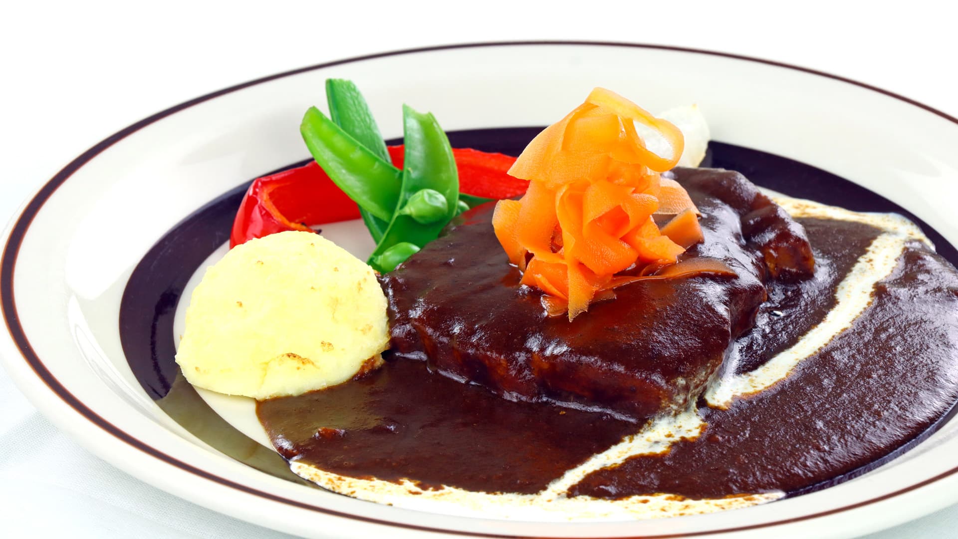 Demi-glace beef main dish with mashed potato and vegetable garnish at Vent Vert