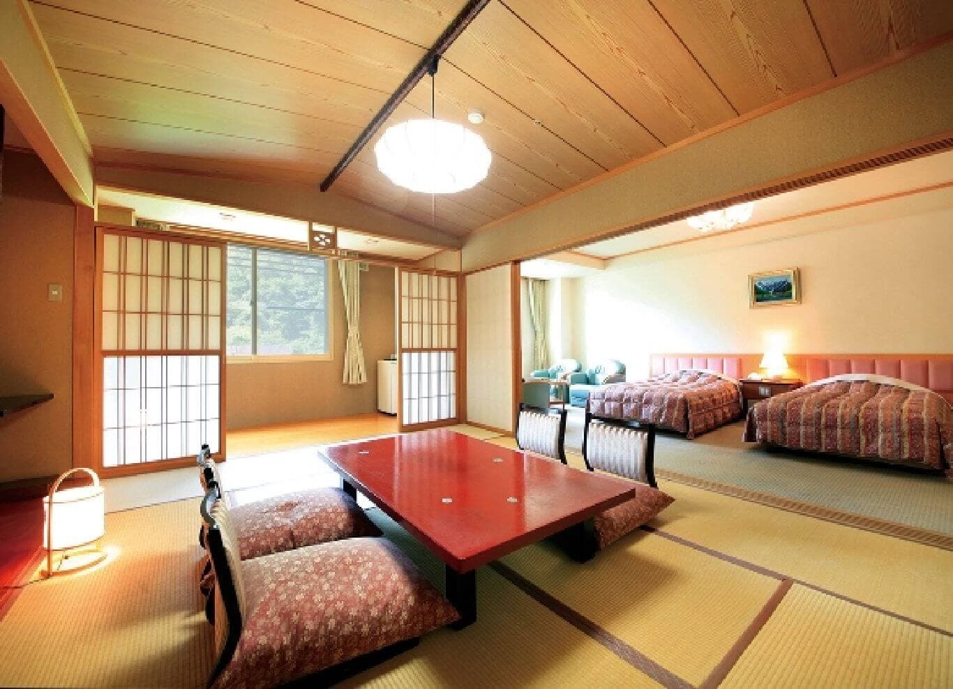 Deluxe Japanese-Western guest room blending tatami seating with twin beds at Park Hotel Miyabitei in Noboribetsu Onsen