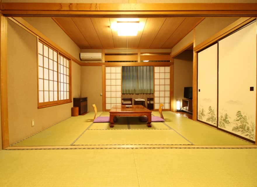 Traditional tatami guest room with a low table and shoji screens