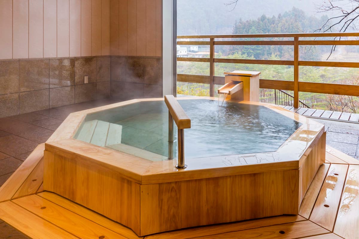 Private wooden open-air tub on a room balcony