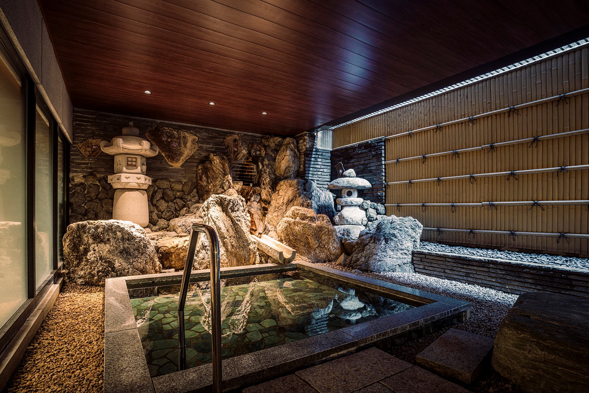 Onsen bathing area at Shinzan with warm ambient lighting