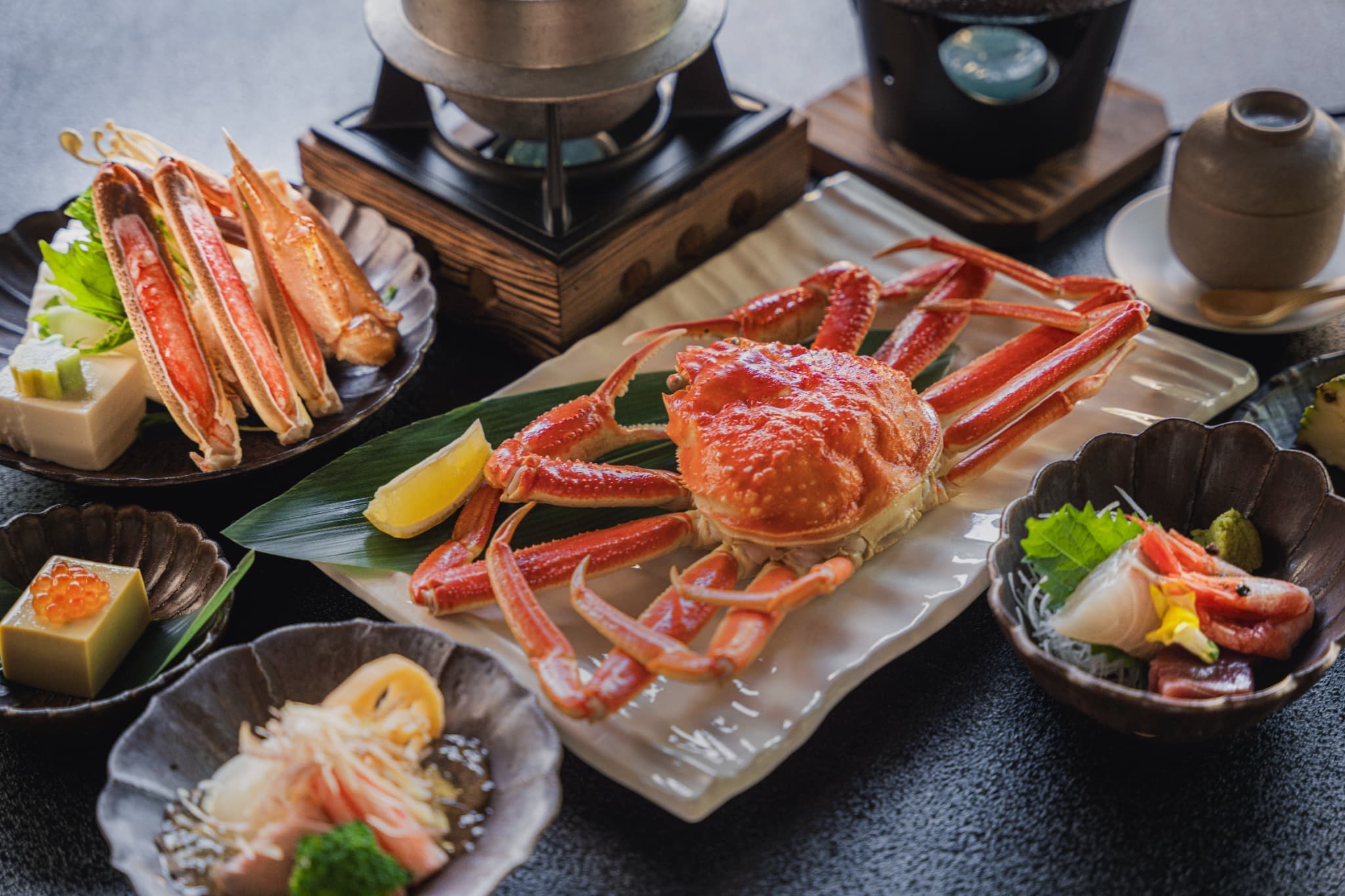Seasonal kaiseki course plating featuring local Kinosaki ingredients at Shinzan