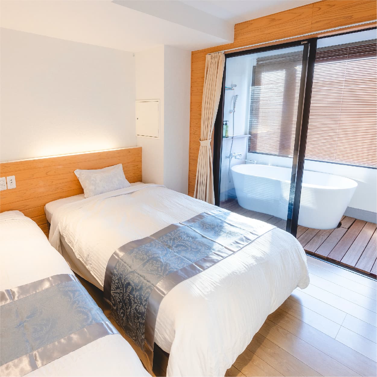 Modern twin room with private in-room bathtub and deck, Hotel Shougetsu Ibusuki Onsen