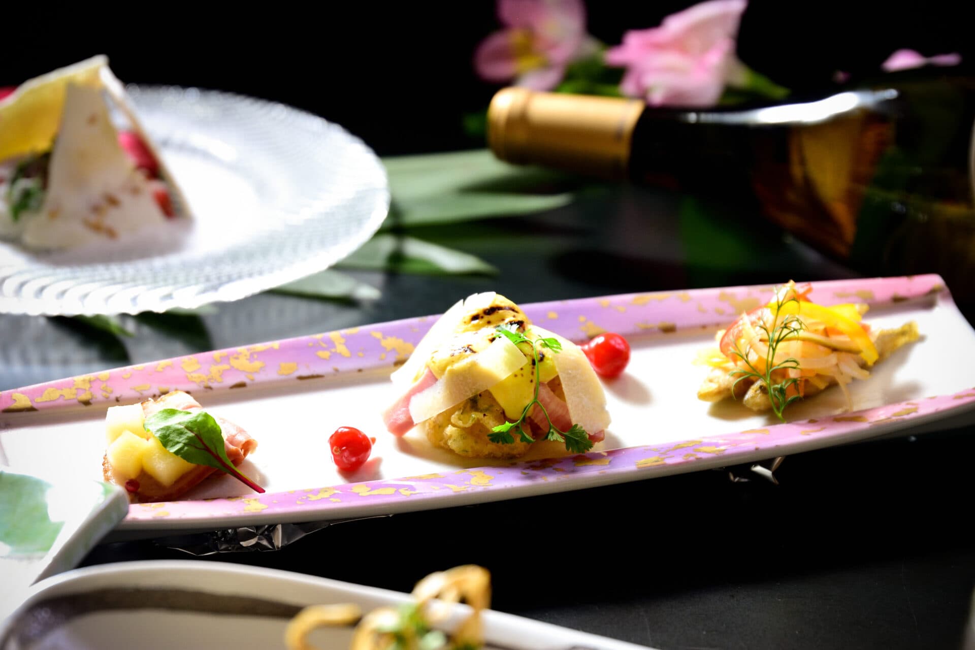 Plated kaiseki appetizer course at Kusatsu Skyland Hotel on an elegant elongated dish
