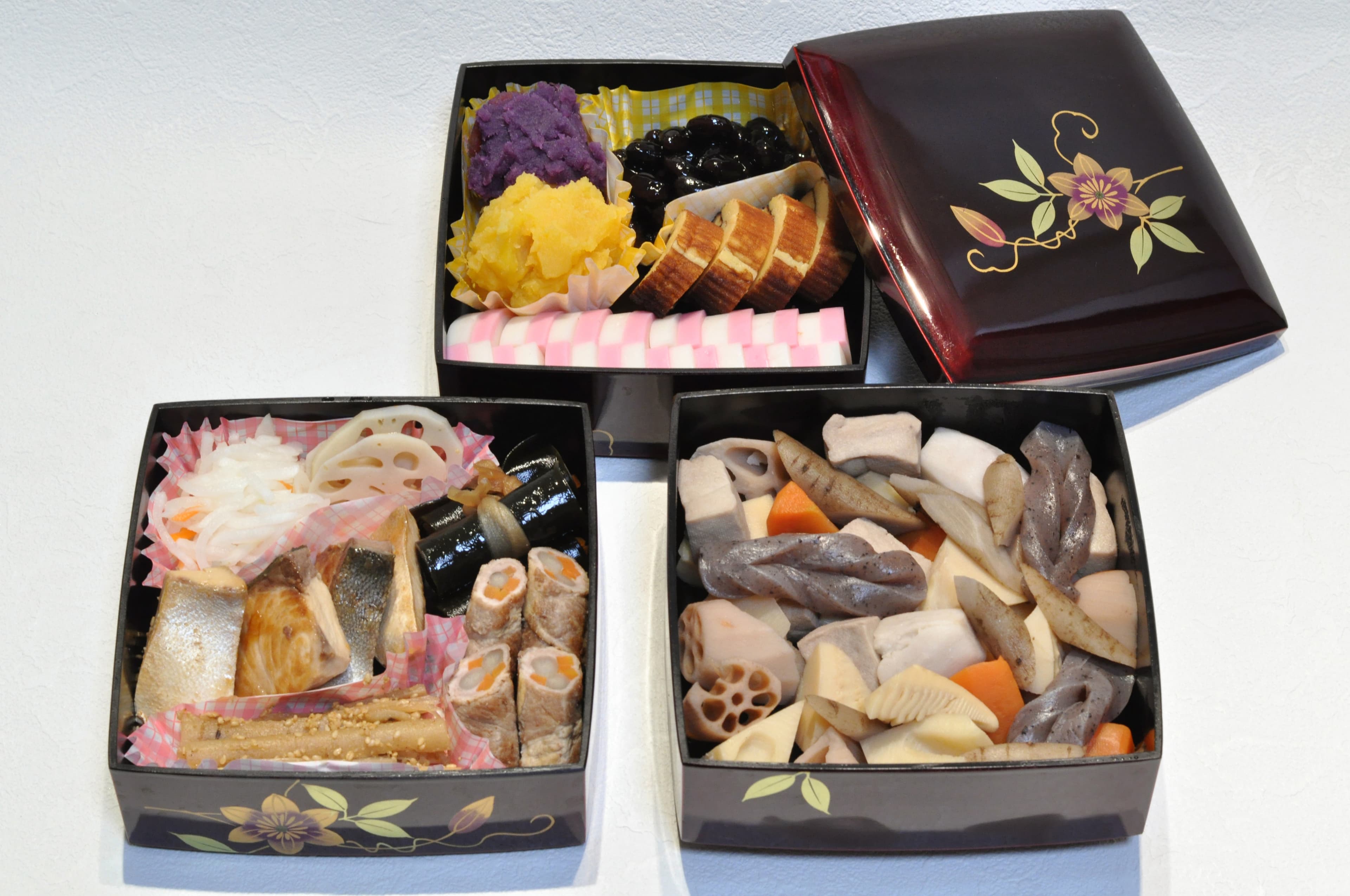 Osechi-ryori served in tiered lacquer boxes at a Japanese ryokan for New Year.
