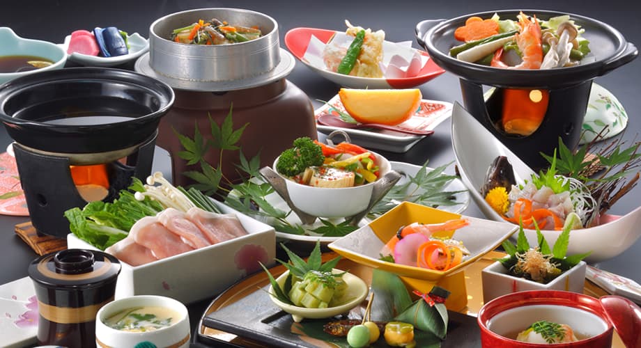 Kaiseki dinner spread with hot pot and seasonal dishes