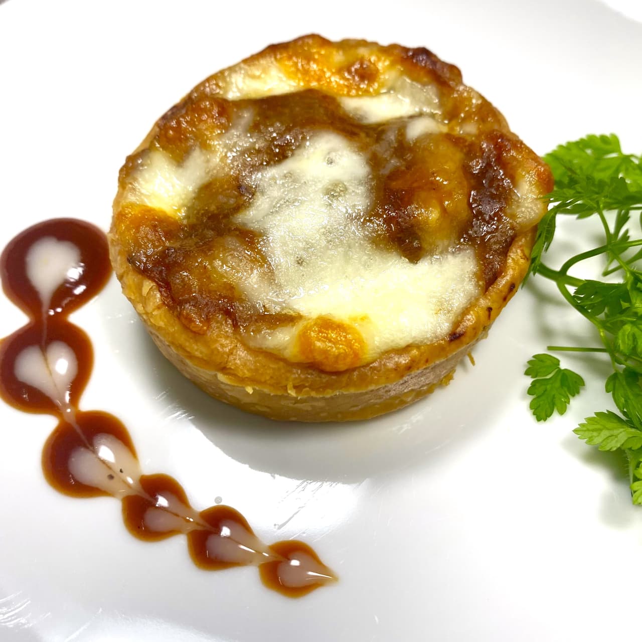 Cheese-baked course dish close-up