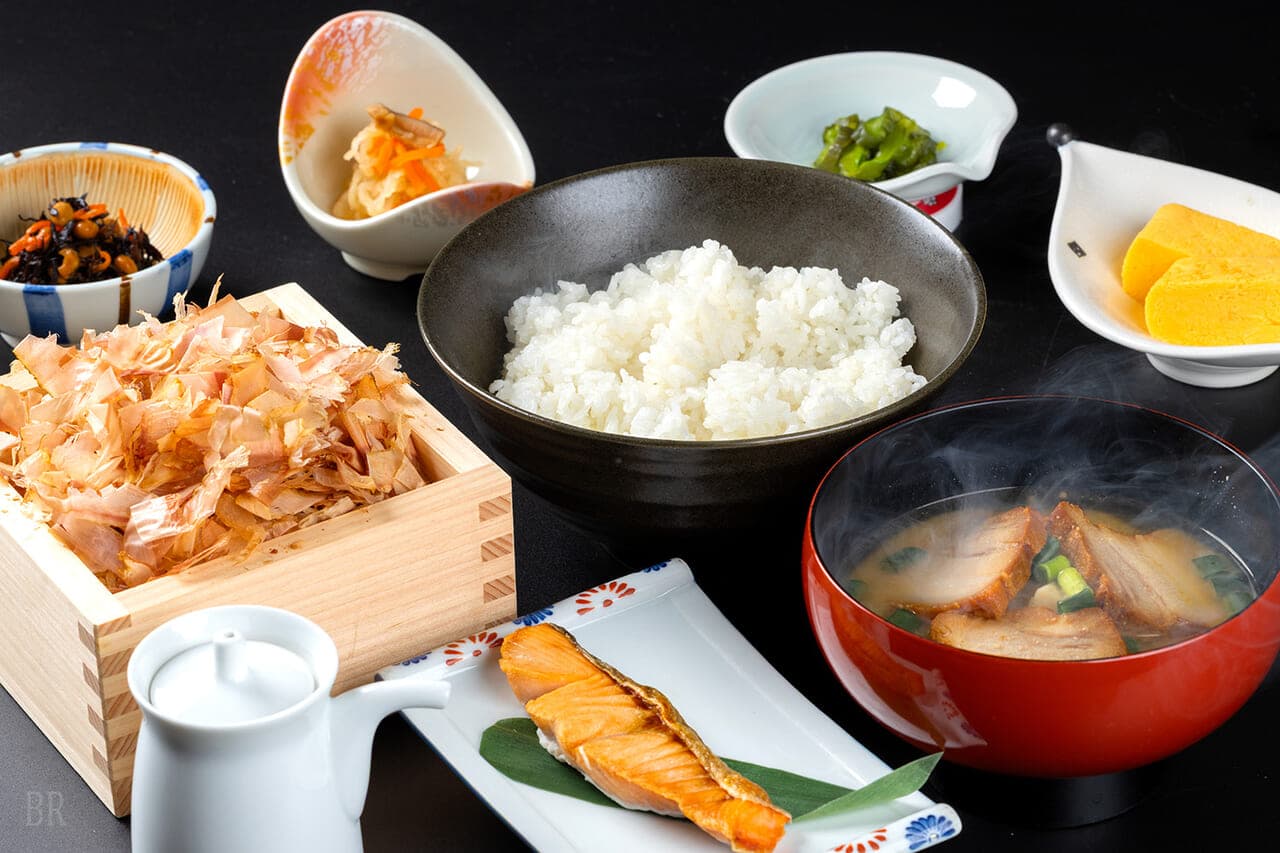 Japanese breakfast set at Hotel Asafuji with rice, grilled salmon, miso soup, tamagoyaki and assorted small dishes