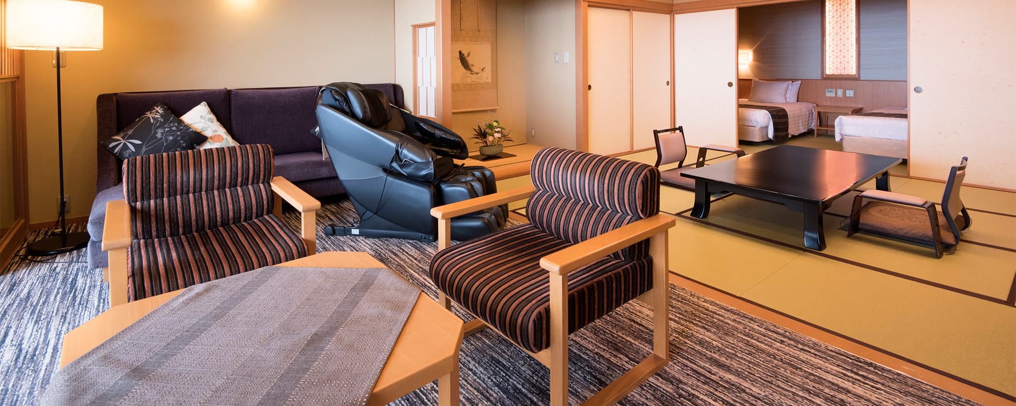 Premium suite at Atami Taikanso combining a tatami living area, sofa lounge and adjoining twin bedroom