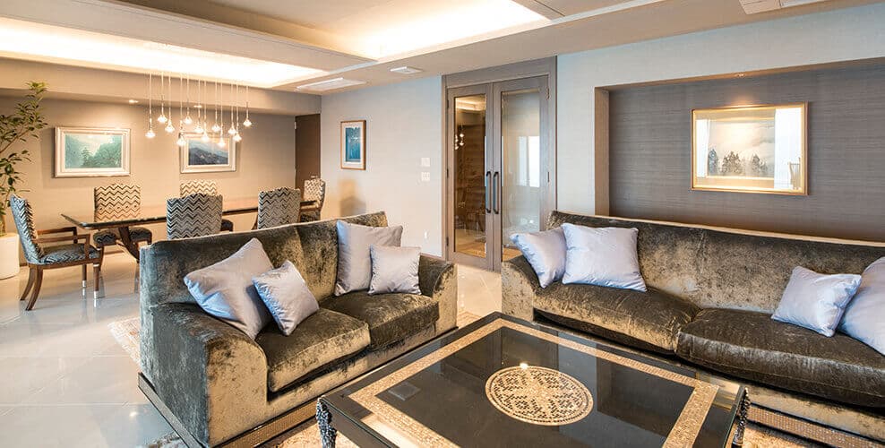 Atami Sekaie Tsuki no Michi penthouse living room with art collection pieces and dining area