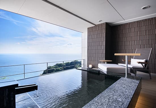 Atami Sekaie private outdoor rotenburo with unobstructed Sagami Bay panorama and lounge chairs