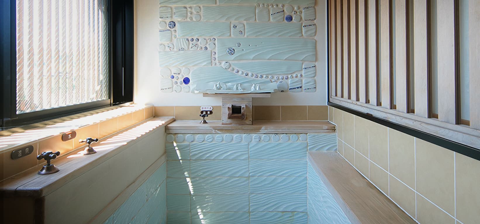 Artistic private bath with indigo floral wave tiles and stone basin at CHAHARU Hanare Dogo Yumekura