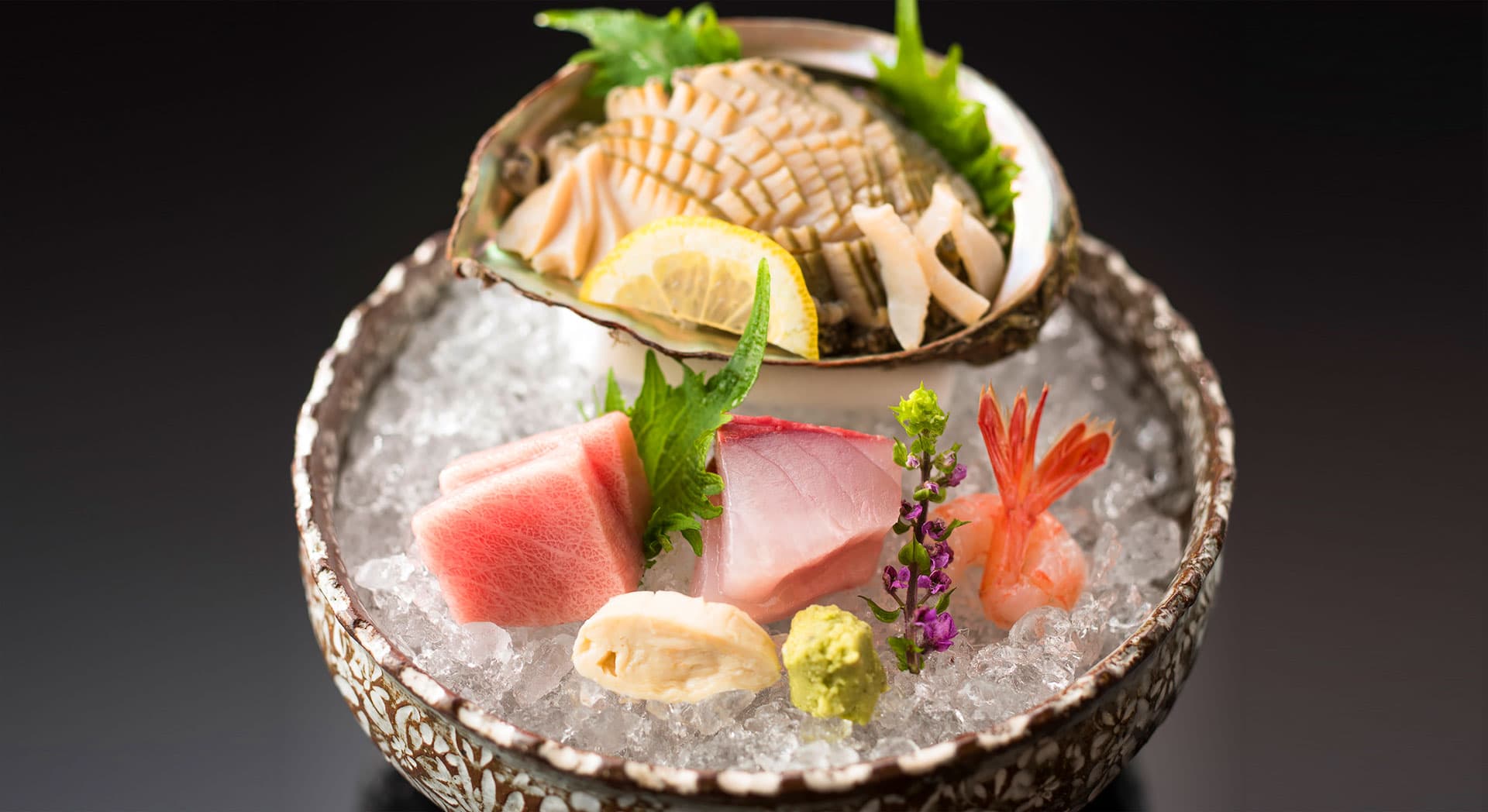Fresh sashimi platter of tuna, sea bream and shrimp served on crushed ice in a Kutani bowl at Kanazawa Chaya
